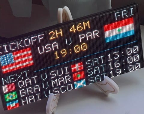And LED Matrix display showing the USA and Paraguay flags and kickoff time of 7pm. Also shows Qatar v Switzerland and 2 more upcoming games.