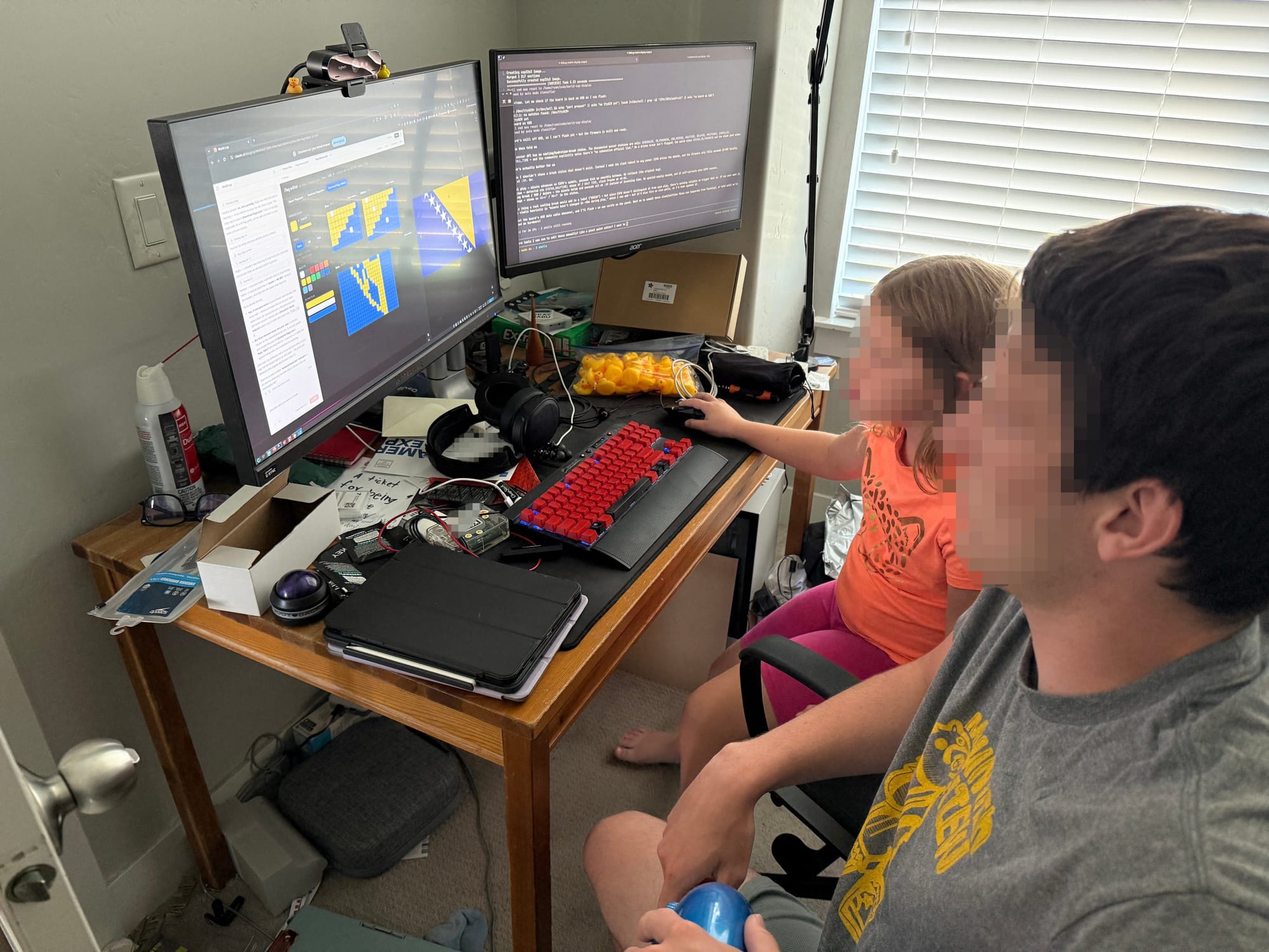 Two kids working on the pixel editor at a computer